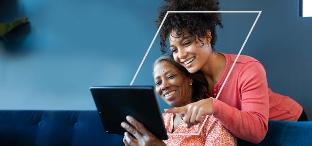 Mother and daughter using tablet